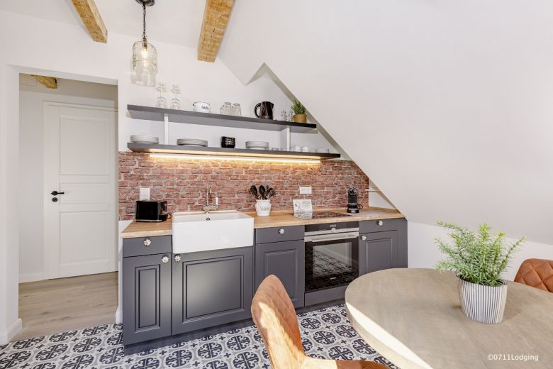 Loft-Style – 2-Zimmer Apartment mit offenem Dachgebälk