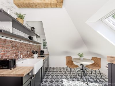 Loft-Style – 2-Zimmer Apartment mit offenem Dachgebälk