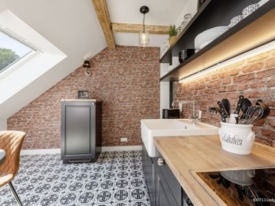 Loft-Style – 2-Zimmer Apartment mit offenem Dachgebälk